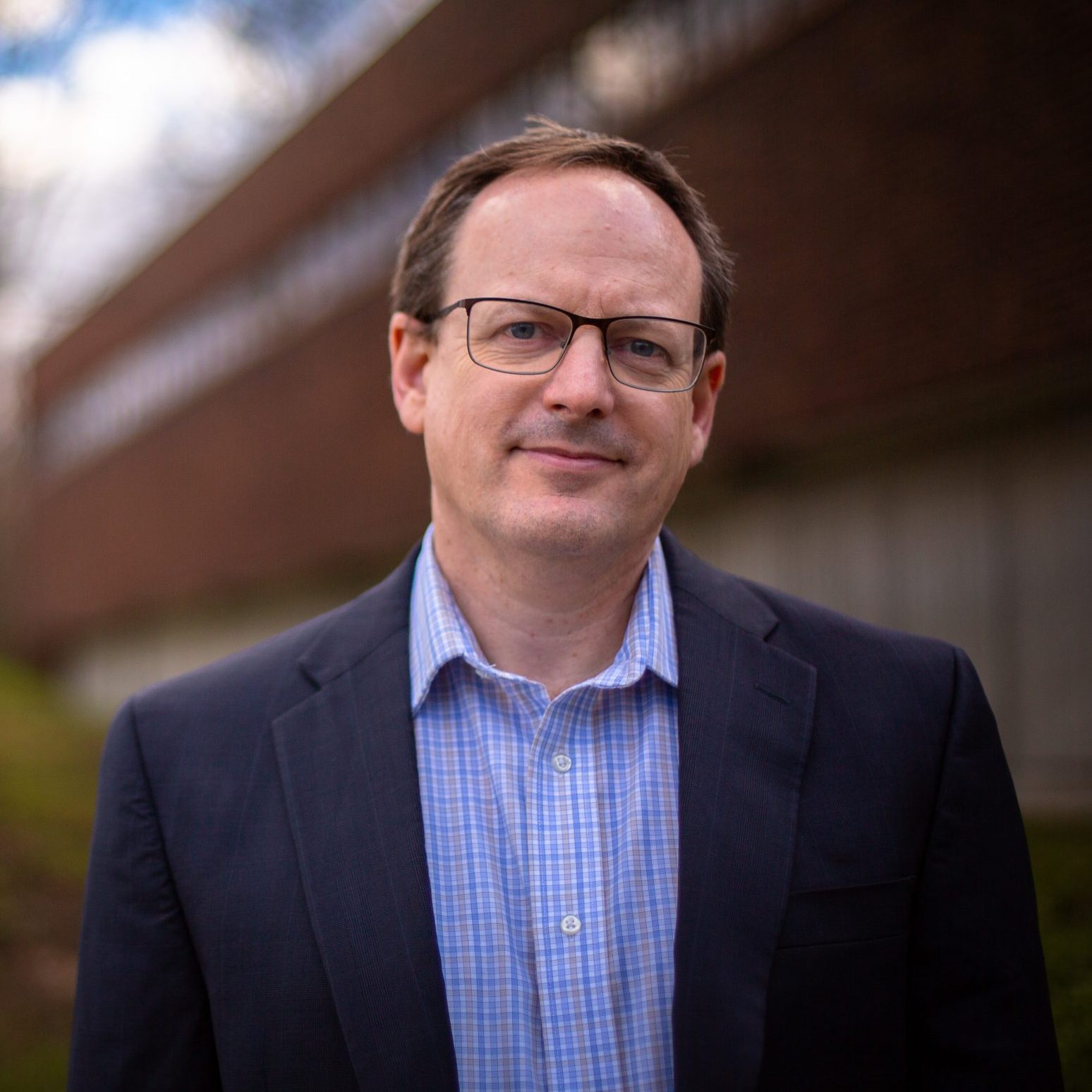 Derek Houston, professor and head of speech, language, and hearing sciences, outside the Phillips Communication Sciences Building (PCSB) on Nov. 28, 2022. (Bri Diaz/UConn Photo)