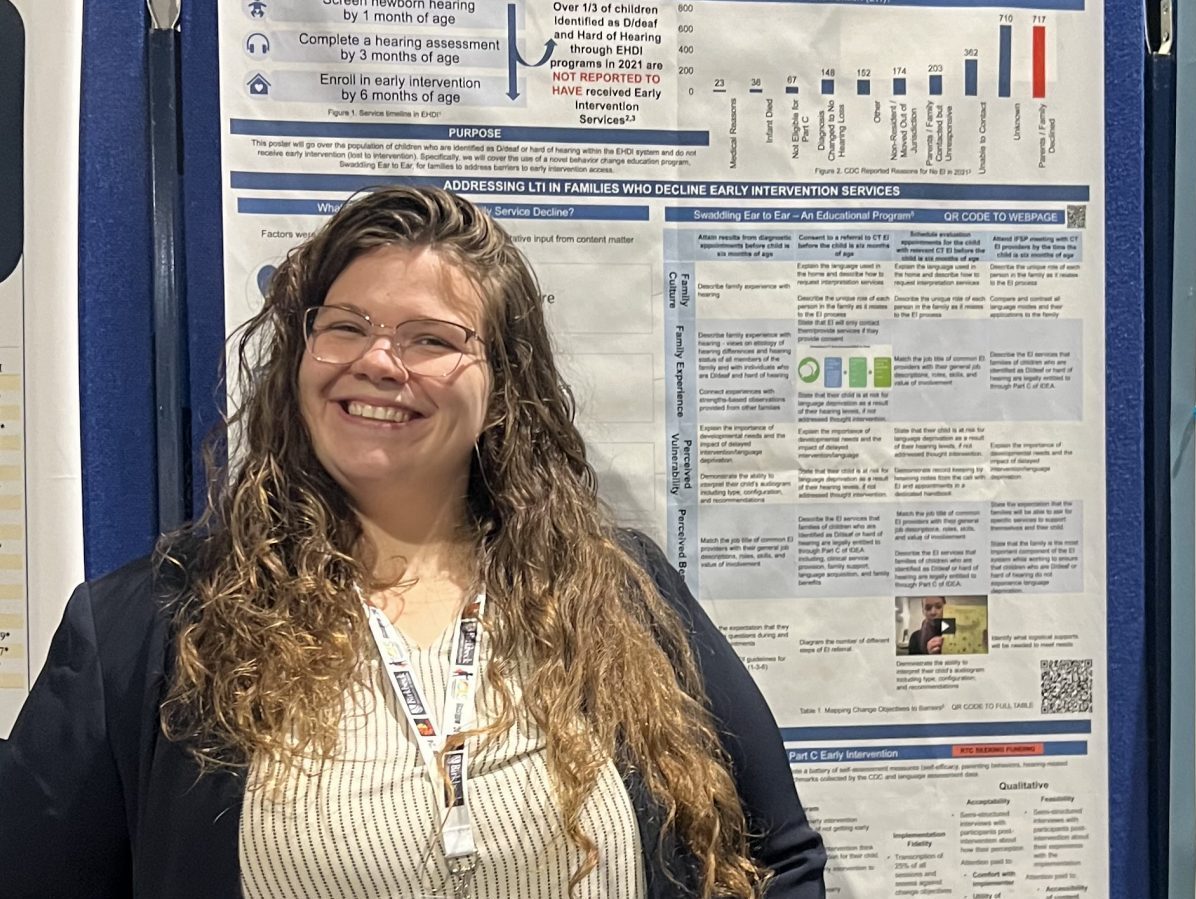 Research Scientist, Torri, smiles in front of her poster titled "Swaddling Ear to Ear - Conceptualizing and supporting early intervention enrollment" at the International Congress of Infant Studies Convergence 2024.