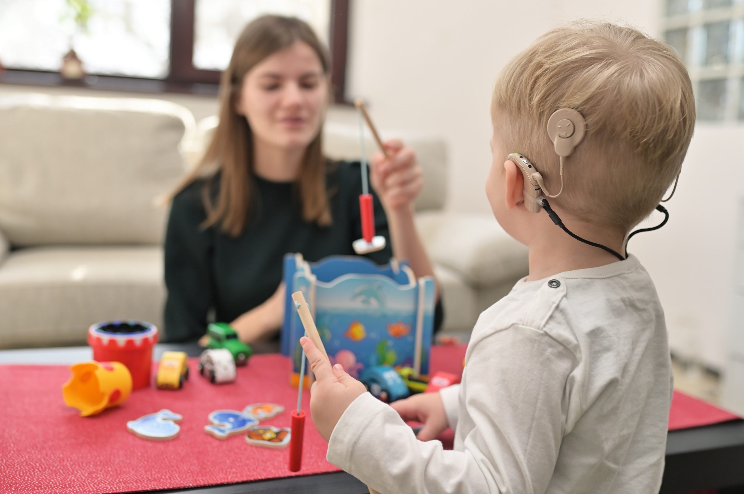 Child with CI playing with toys