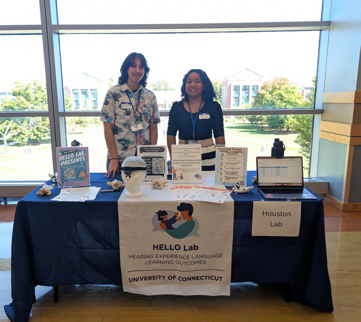 B. and Narindra smiling at the camera while tabling