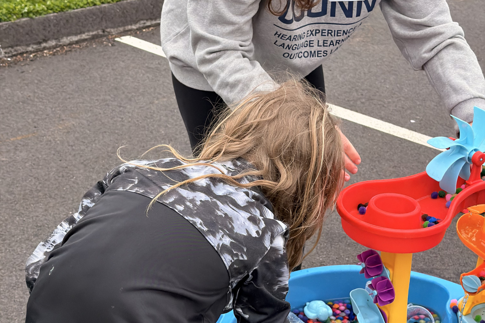 3 Miya and a child playing with water and crafts